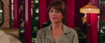 Movie still from “Ghostbusters” (2016), directed by Paul Feig – A person wearing a shirt; Close Up shot, Over the shoulder angle