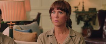 Movie still from “Ghostbusters” (2016), directed by Paul Feig – A person wearing a jacket; Close Up shot, Over the shoulder angle