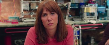 Movie still from “Ghostbusters” (2016), directed by Paul Feig – A person with long brown hair; Close Up shot, Over the shoulder angle