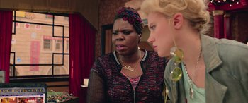 Movie still from “Ghostbusters” (2016), directed by Paul Feig – Two women standing next to each other in front of a mirror; Close Up shot, Over the shoulder angle