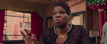 Movie still from “Ghostbusters” (2016), directed by Paul Feig – A person sitting down with her mouth wide open; Close Up shot, Over the shoulder angle