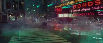 Movie still from “Ghostbusters” (2016), directed by Paul Feig – A city street at night in the pouring rain; Extreme Wide shot, High angle