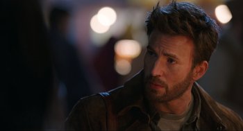 Movie still from “Ghosted” (2023), directed by Dexter Fletcher – A person wearing a jacket; Close Up shot, Over the shoulder angle