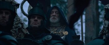 Movie still from “Gladiator” (2000), directed by Ridley Scott – Two men in medieval garb are standing next to each other; Close Up shot, Low angle