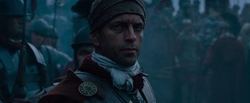 Movie still from “Gladiator” (2000), directed by Ridley Scott – A person wearing a hat; Close Up shot, Low angle