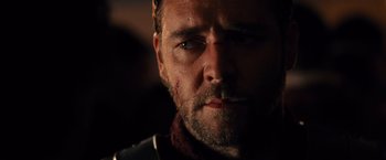 Movie still from “Gladiator” (2000), directed by Ridley Scott – A man's face in the dark; Close Up shot, Low angle