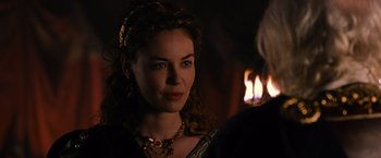Movie still from “Gladiator” (2000), directed by Ridley Scott – A woman with a necklace and a candle in the background; Close Up shot, Over the shoulder angle