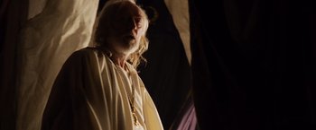 Movie still from “Gladiator” (2000), directed by Ridley Scott – An old man with a long white beard wearing a white robe; Medium shot, Low angle