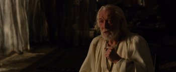Movie still from “Gladiator” (2000), directed by Ridley Scott – An old man with long white hair and a beard; Medium shot, Over the shoulder angle