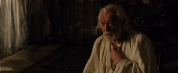 Movie still from “Gladiator” (2000), directed by Ridley Scott – An old man with white hair and a long white beard; Close Up shot, Over the shoulder angle