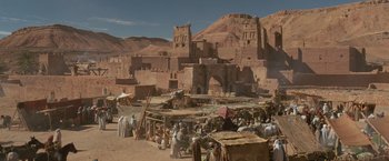 Movie still from “Gladiator” (2000), directed by Ridley Scott – A group of people standing in front of a large building; Extreme Wide shot, High angle