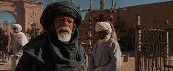 Movie still from “Gladiator” (2000), directed by Ridley Scott – A man with a white beard and a man with a white turban; Medium shot, Low angle