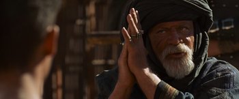 Movie still from “Gladiator” (2000), directed by Ridley Scott – An old man with his hands clasped in front of his face; Close Up shot, Over the shoulder angle