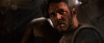 Movie still from “Gladiator” (2000), directed by Ridley Scott – A person with a beard looking at the camera; Close Up shot, Over the shoulder angle