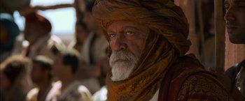 Movie still from “Gladiator” (2000), directed by Ridley Scott – An old man with a long beard and a turban; Close Up shot, Over the shoulder angle