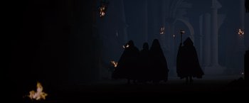 Movie still from “Gladiator” (2000), directed by Ridley Scott – A group of people standing next to each other in the dark; Extreme Wide shot, Low angle