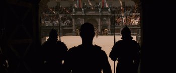 Movie still from “Gladiator” (2000), directed by Ridley Scott – A group of people standing in front of an audience; Extreme Wide shot, Low angle