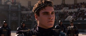 Movie still from “Gladiator” (2000), directed by Ridley Scott – A person wearing a crown; Close Up shot, Low angle