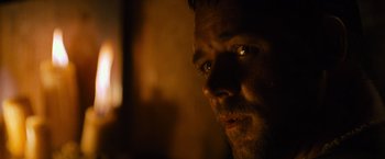 Movie still from “Gladiator” (2000), directed by Ridley Scott – A man's face in a dimly - lit room; Extreme Close Up shot, Over the shoulder angle