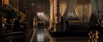 Movie still from “Gladiator” (2000), directed by Ridley Scott – A man standing in front of a large window; Extreme Wide shot, High angle