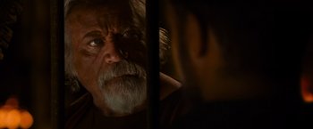 Movie still from “Gladiator” (2000), directed by Ridley Scott – An old man with a beard looking into a mirror; Close Up shot, Over the shoulder angle