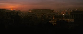 Movie still from “Gladiator” (2000), directed by Ridley Scott – A view of a large building in the dark; Extreme Wide shot, Low angle