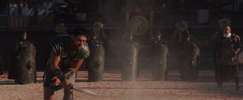 Movie still from “Gladiator” (2000), directed by Ridley Scott – A group of men standing next to each other; Wide shot, Over the shoulder angle