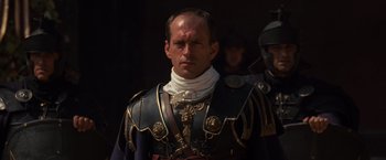 Movie still from “Gladiator” (2000), directed by Ridley Scott – A man in a suit of a medieval knight; Close Up shot, Low angle