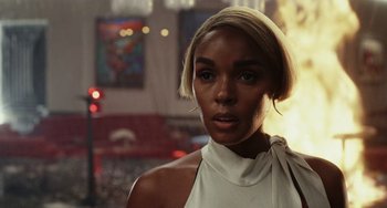 Movie still from “Glass Onion” (2022), directed by Rian Johnson – A person with short hair; Close Up shot, Over the shoulder angle