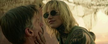 Movie still from “God Is a Bullet” (2023), directed by Nick Cassavetes – A woman with tattoos on her face and a man with tattoos on his face; Close Up shot, Over the shoulder angle