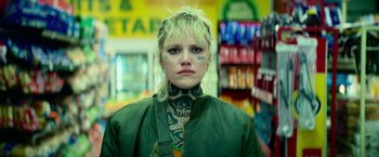 Movie still from “God Is a Bullet” (2023), directed by Nick Cassavetes – A woman with tattoos on her face and neck; Close Up shot, Low angle