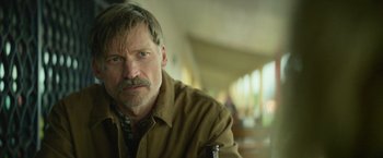 Movie still from “God Is a Bullet” (2023), directed by Nick Cassavetes – A person with a mustache; Close Up shot, Over the shoulder angle