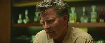 Movie still from “God Is a Bullet” (2023), directed by Nick Cassavetes – A person wearing a tan shirt; Close Up shot, Low angle