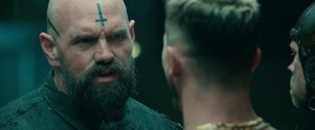 Movie still from “God Is a Bullet” (2023), directed by Nick Cassavetes – A man with a cross on his forehead looking at himself in the mirror; Close Up shot, Over the shoulder angle