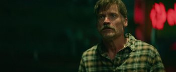 Movie still from “God Is a Bullet” (2023), directed by Nick Cassavetes – A person wearing a plaid shirt; Close Up shot, Low angle