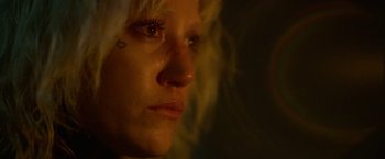 Movie still from “God Is a Bullet” (2023), directed by Nick Cassavetes – A woman's face in the dark; Extreme Close Up shot, Overhead angle