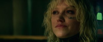 Movie still from “God Is a Bullet” (2023), directed by Nick Cassavetes – A person with tattoos on their face; Close Up shot, Low angle