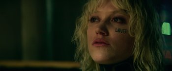 Movie still from “God Is a Bullet” (2023), directed by Nick Cassavetes – A person's face with tattoos; Close Up shot, Low angle