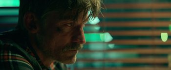 Movie still from “God Is a Bullet” (2023), directed by Nick Cassavetes – A person with a beard and mustache; Close Up shot, Over the shoulder angle