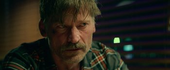 Movie still from “God Is a Bullet” (2023), directed by Nick Cassavetes – A person with a beard and mustache; Close Up shot, Over the shoulder angle