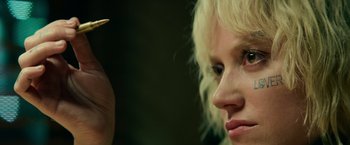 Movie still from “God Is a Bullet” (2023), directed by Nick Cassavetes – A person with a hair brush; Extreme Close Up shot, Low angle