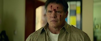 Movie still from “God Is a Bullet” (2023), directed by Nick Cassavetes – A person with blood on his face; Close Up shot, Low angle