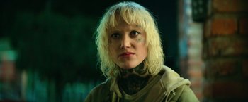 Movie still from “God Is a Bullet” (2023), directed by Nick Cassavetes – A woman with tattoos on her neck and face; Close Up shot, Low angle