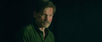 Movie still from “God Is a Bullet” (2023), directed by Nick Cassavetes – A person wearing a green shirt; Close Up shot, Over the shoulder angle