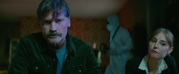 Movie still from “God Is a Bullet” (2023), directed by Nick Cassavetes – A person wearing a green jacket; Close Up shot, Over the shoulder angle