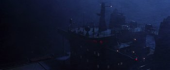 Movie still from “Godzilla” (1998), directed by Roland Emmerich – A ship in the dark with lights on it's deck; Extreme Wide shot, Low angle