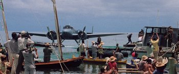 Movie still from “Godzilla” (1998), directed by Roland Emmerich – A group of people on small boats in the water; Extreme Wide shot, High angle