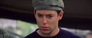 Movie still from “Godzilla” (1998), directed by Roland Emmerich – A person wearing a hat; Close Up shot, Low angle