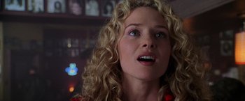 Movie still from “Godzilla” (1998), directed by Roland Emmerich – A person with curly hair; Close Up shot, Over the shoulder angle