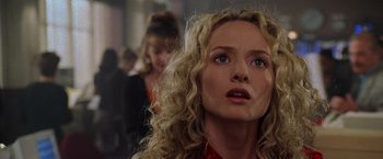 Movie still from “Godzilla” (1998), directed by Roland Emmerich – A person with curly hair; Close Up shot, Low angle